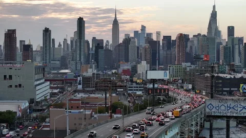 Aerial view of freeway traffic entering New York City Stock Footage 253682727