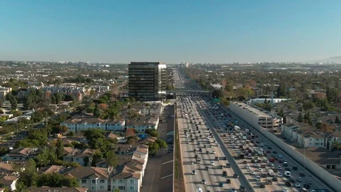 Aerial view of freeway traffic on I-405 in urban Los Angeles with cars Stock Footage 124100729