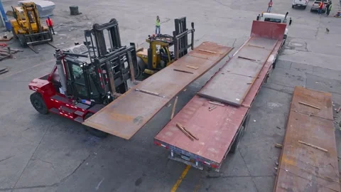 Aerial view of Freight Elevator loading steel on industrial truck at port Stock Footage 238495901