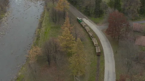 Aerial view of a freight train carrying lumber Stock Footage 253549832