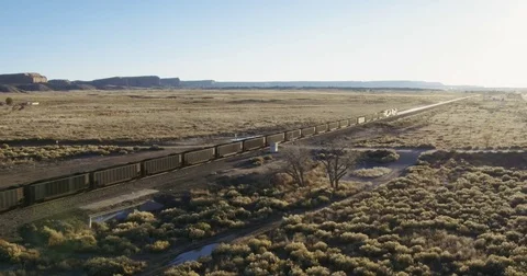Aerial view of freight train in desert, Gallup, New Mexico, United States Stock Footage 70431028
