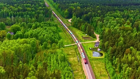 Aerial view of a freight train in a forest near Riga, Latvia. Stock Footage 340602472