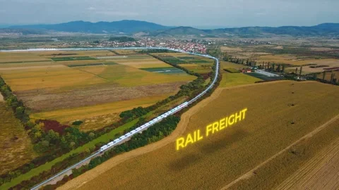 Aerial view of a freight train moving cargo delivery or rail freight Stock Footage 258775062
