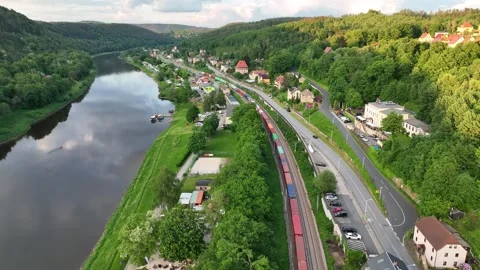 Aerial view of freight train passing along a valley in Germany Stock Footage 276967807