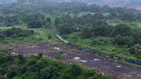 Aerial View of Freight Train Passing Through Rural Landscape 스톡 동영상 330456768
