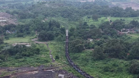 Aerial View of Freight Train Passing Through Rural Landscape Vídeo Stock 330456782