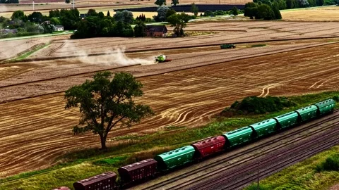 Aerial view of freight train passing through agricultural fields, Latvia. Stock Footage 340824516