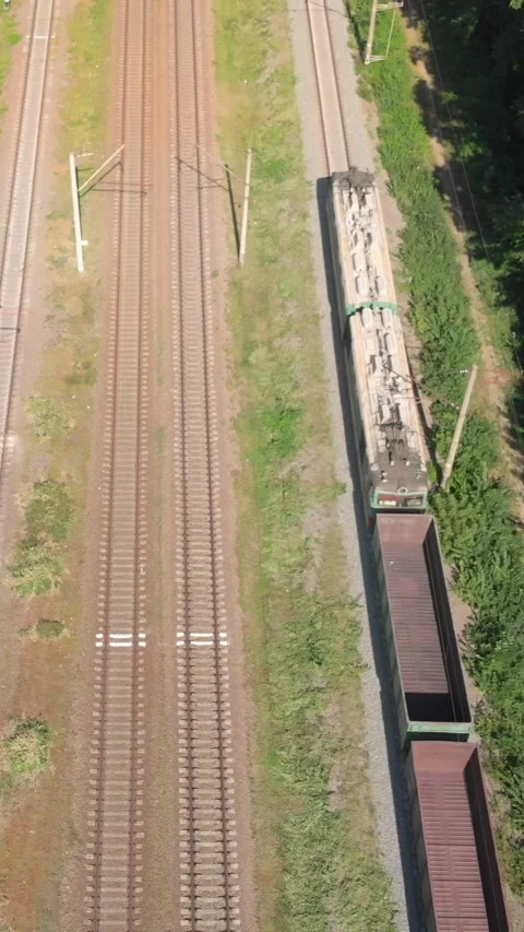 Aerial view of freight train on railway tracks Video stock 347367376