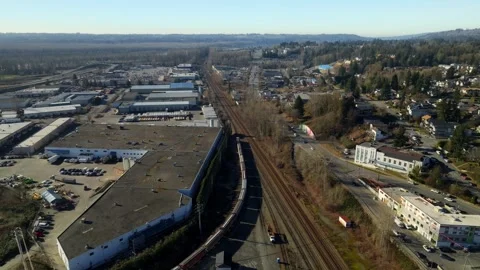 Aerial View Of Freight Train Running Along Industrial Area In Canada. Stock Footage 336983431