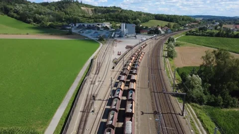 Aerial view of a freight train at a stone quarry and rail siding Видео 339272558