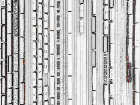 Aerial view of freight train yard covered in snow 库存照片