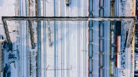 Aerial view of freight train yard covered in snow Stock Photos