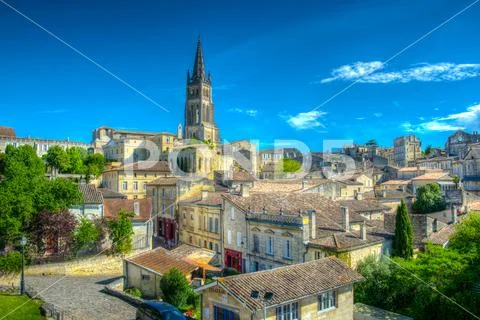Aerial view of French village Saint Emilion dominated by spire of the monolit Stock Photos
