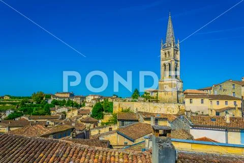 Aerial view of French village Saint Emilion dominated by spire of the monolit Stock Photos