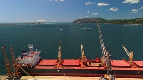 Aerial View Of Front End Loader Filling Bulk Carrier Cargo Hold With Sand Stock Footage 339031526