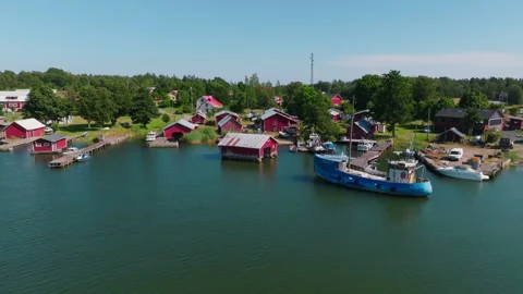 Aerial view in front of the famous Rosala village, traditional red boathouses Stock Footage 344916336