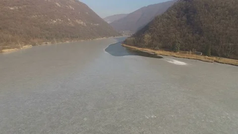 Aerial view of frozen surface of small lake in Italy Stock Footage 72107272
