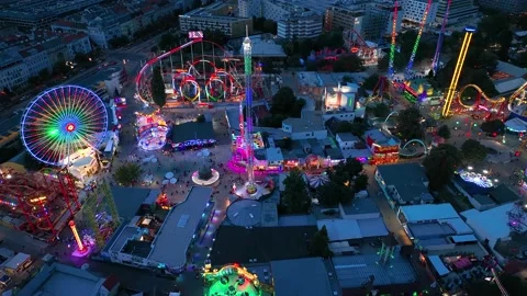 Aerial view fun fair. Twilight time illumination Vienna amusement park Prater Stock Footage 232855609