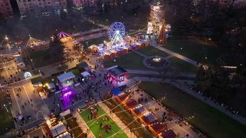 Aerial view fun fair. Twilight time illumination Sofia city amusement park Stock Footage 319941995