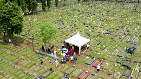 Aerial View Funeral Process in Green Public Cemetary Jakarta Stock Footage 148424495