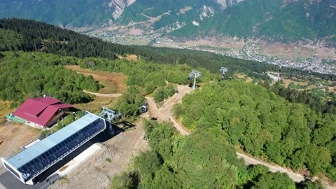Aerial view of funicular in the mountains. cable car in ski resort Stock Footage 238899542