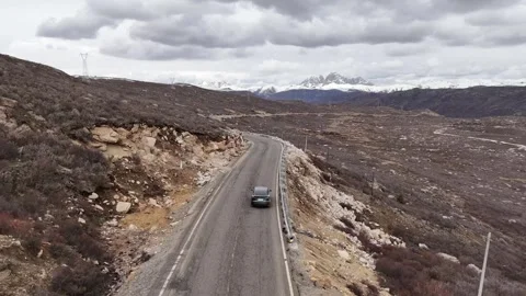Aerial view of G317 mountain road near Xinlong County Sichuan Stock Footage 340217530