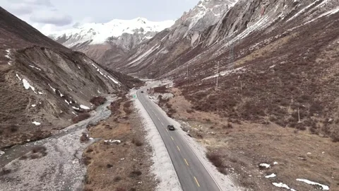 Aerial view of G317 mountain valley road in Garze County Stock Footage 340217468