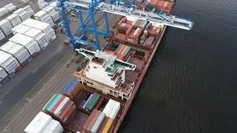 Aerial View of Gantry Crane Loading and Unloading Ship Stock Footage 99848279