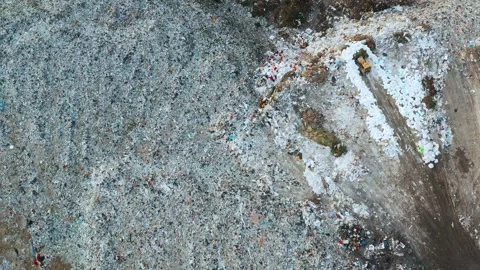 Aerial view of garbage pile in trash dump. Bulldozer woving waste on landfill Stock Footage 264165787