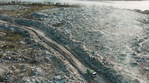 Aerial view of garbage pile in trash dump. Dump track drives trough landfill Stock-Footage 267977173