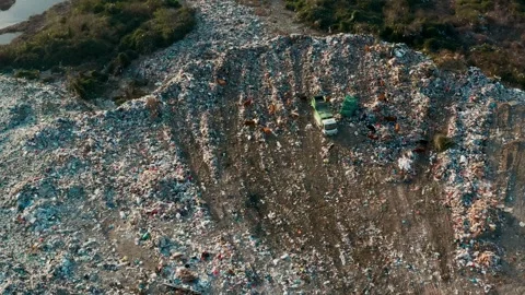 Aerial view of garbage pile in trash dump. Dump track unload waste at landfill Stock Footage 267977628
