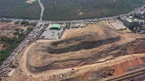 Aerial View of Garbage Trucks Moving on The Landfill|Garbage Dump With Bus Depot Stock Footage 155295626