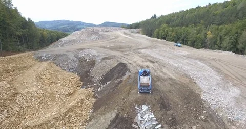 Aerial view garbage trucks unload garbage to a landfill. Plastic  crisis. Stock Footage 120942834