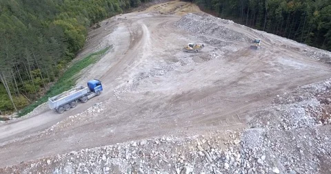 Aerial view garbage trucks unload garbage to a landfill. Plastic  crisis. Stock Footage 120943134