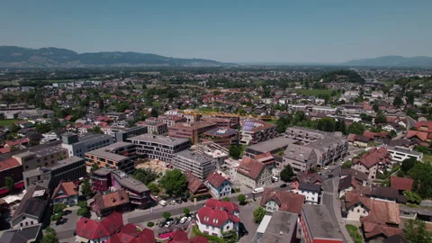 Aerial View of Garnmarkt District in Götzis with Urban Development and Alpine Stock Footage 336339385