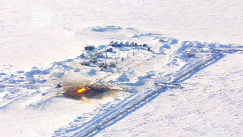 Aerial view of gas flaring at arctic oil extraction site Stock Footage 337037597