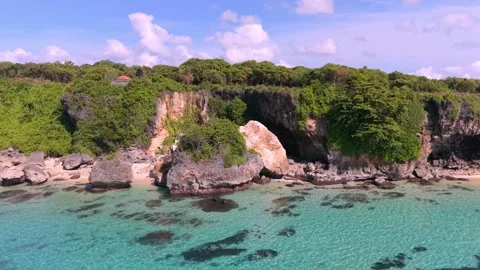 Aerial view of Geger Beach rugged cliffs in Bali, Indonesia Stock Footage 336233309