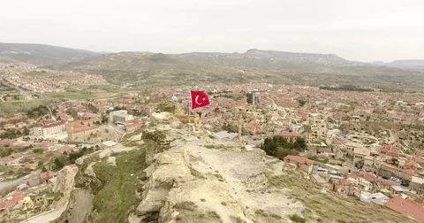 Aerial view, general view of Urgup and Turkish flags, Cappadocia, TURKEY  Vídeo Stock 76044904