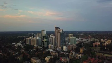 Aerial view of generic city during sunset 스톡 동영상 85568009