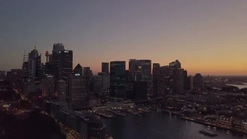 Aerial view of generic cityscape skyline at sunset night Stock Footage 86093533