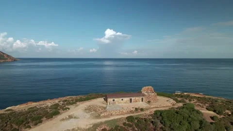 Aerial view of Genoise tower overlooking Galéria beach in Corsica Stock Footage 142982239