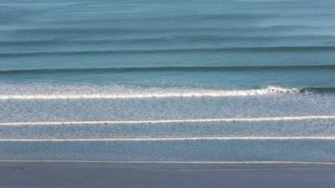 Aerial view of gentle waves on Woolacombe beach Stock Footage 141508069
