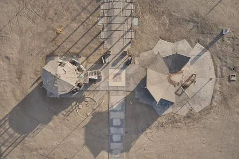 Aerial view of geometric architectural structures in desert landscape Stock Photos