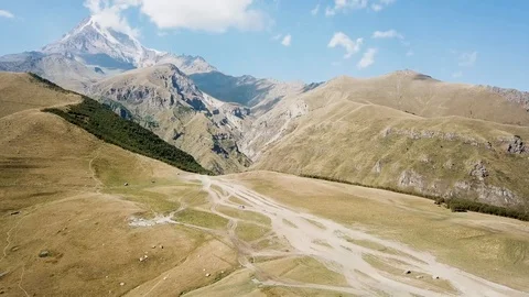 Aerial view of Gergeti Trinity Church, Tsminda Sameba. Kazbegi. Georgia 2017 Stock Footage 106501383