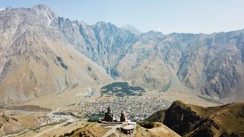 Aerial view of Gergeti Trinity Church, Tsminda Sameba. Kazbegi. Georgia 2017 Stock Footage 106501405
