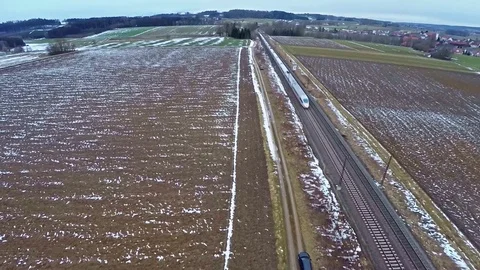 Aerial view of german ICE train passing by on rails on a cloudy misty day Stock Footage 96024012