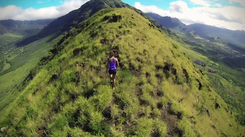 Aerial View Of Girl Hiking Mountain In Hawaii Stock Footage