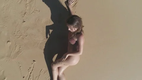 Aerial view Girl next door bikini model on the beach in Maui Видео 84345053