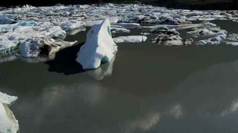 Aerial view Glacial icebergs floating nr main glacier, USA Stock Footage
