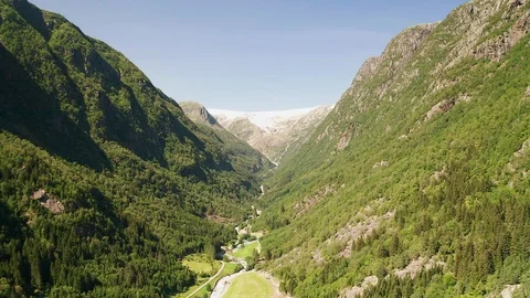 Aerial view of a glacier and stream of  water or river running from mountain Stock Footage 116874356